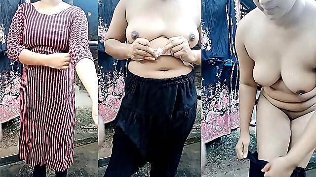 Beautiful desi cute girl's bath scene. Showering and dress changing in open village bathroom 