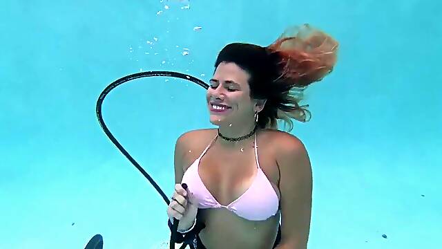 Girl pleasures herself underwater